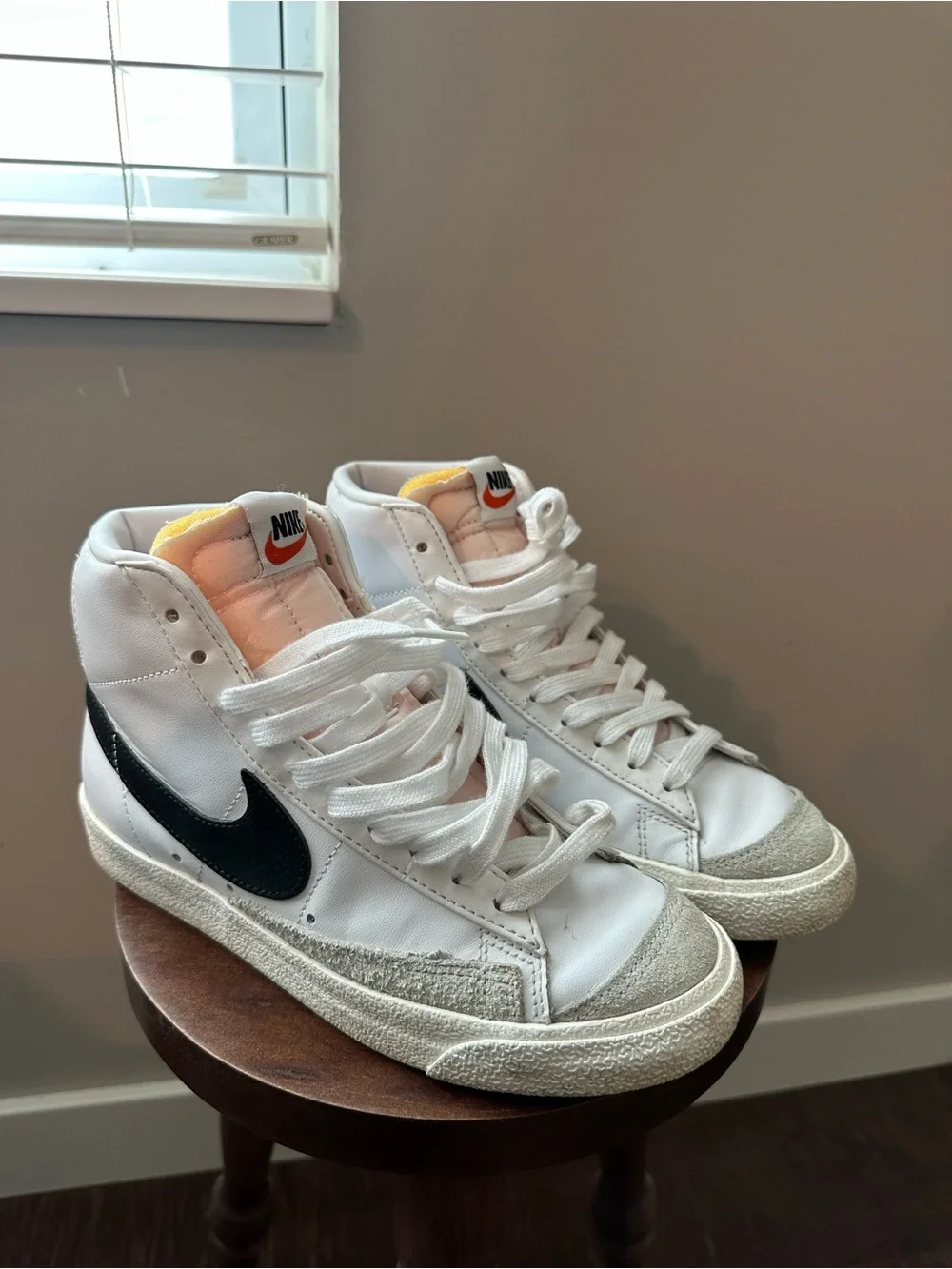 Nike White High-Top Sneakers with Black Swoosh and Pink Tongue
